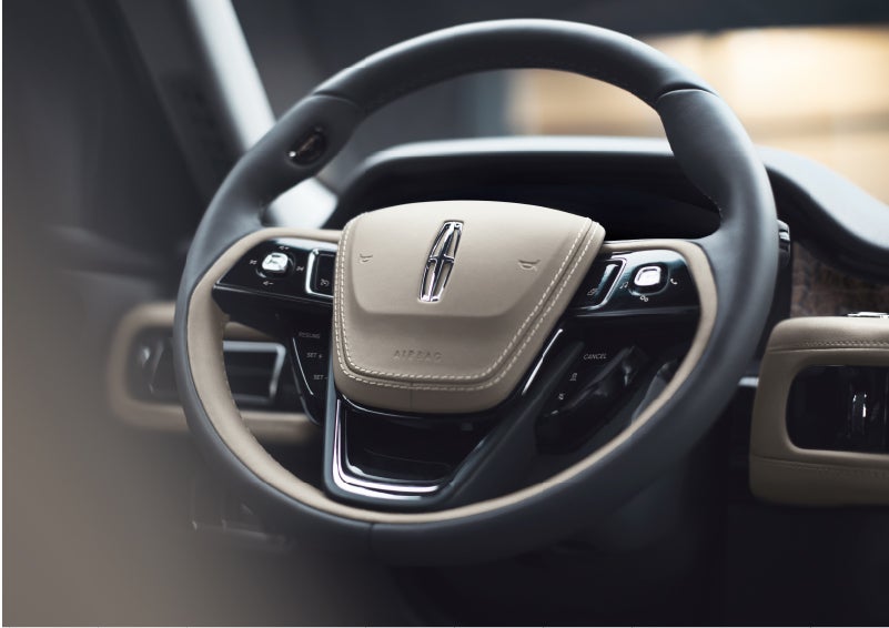 The intuitively placed controls of the steering wheel on a 2023 Lincoln Aviator® SUV | Lincoln of Cutler Bay in Miami FL