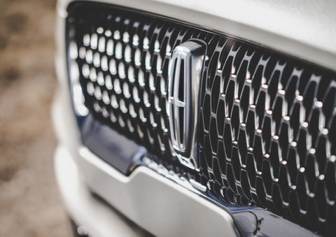 The grille of the 2024 Lincoln Aviator® Reserve model with an eye-catching repeated field of Lincoln Star logo shapes | Lincoln of Cutler Bay in Miami FL