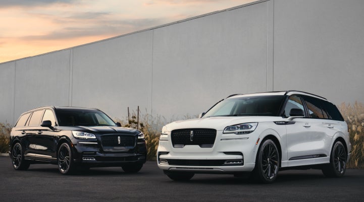 Two Lincoln Aviator® SUVs are shown with the available Jet Appearance Package | Lincoln of Cutler Bay in Miami FL