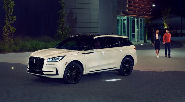 Two people approach a 2024 Lincoln Corsair® SUV featuring the available Jet Appearance Package. | Lincoln of Cutler Bay in Miami FL