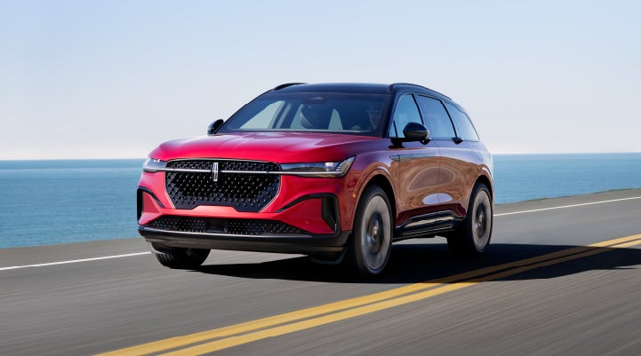 A 2024 Lincoln Nautilus® SUV is being driven on a seaside roadway. | Lincoln of Cutler Bay in Miami FL