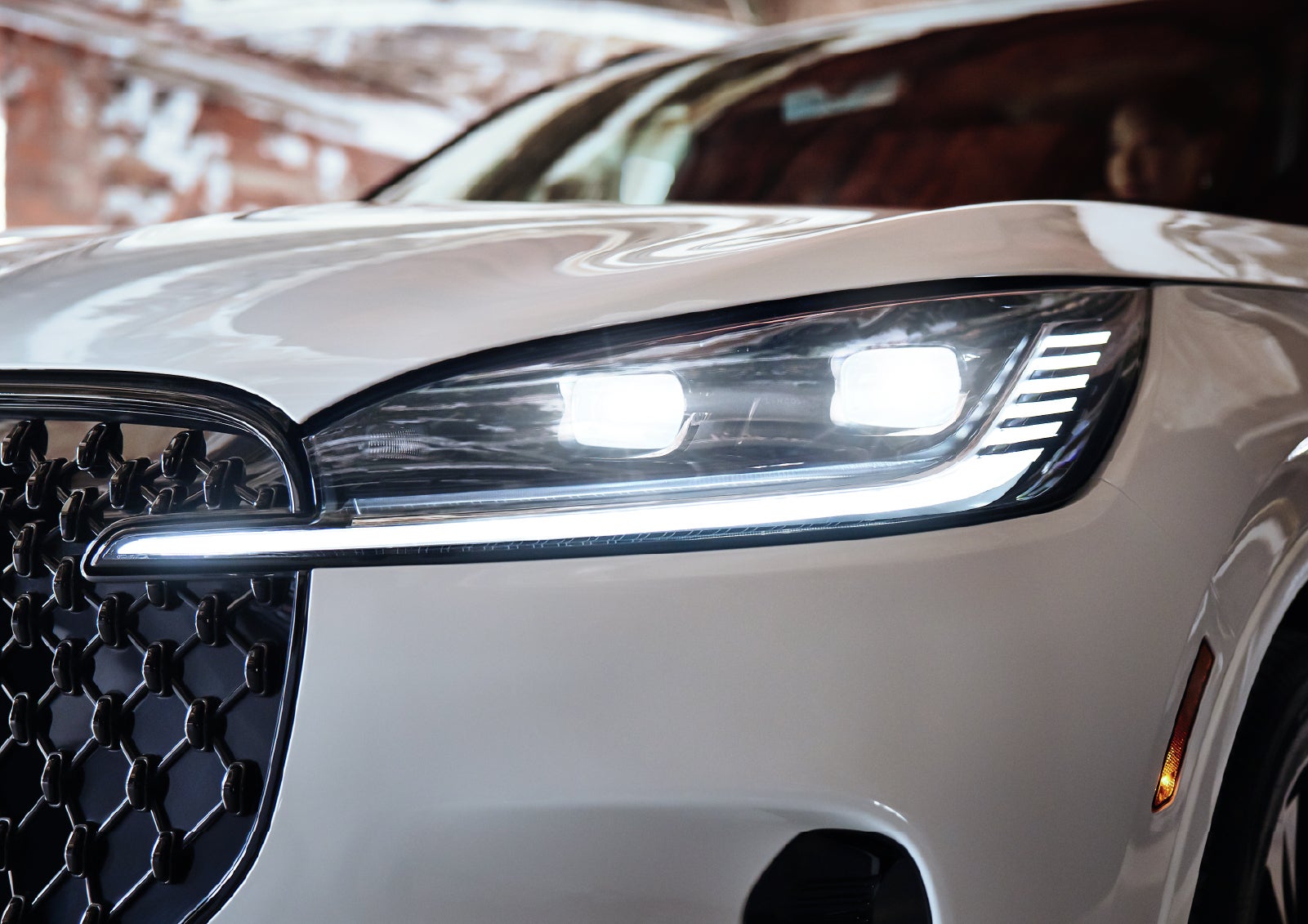 A close-up of a headlamp on the 2027 Lincoln Aviator® SUV is shown. | Lincoln of Cutler Bay in Miami FL