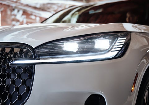 A close-up of a headlamp on the 2027 Lincoln Aviator® SUV is shown. | Lincoln of Cutler Bay in Miami FL