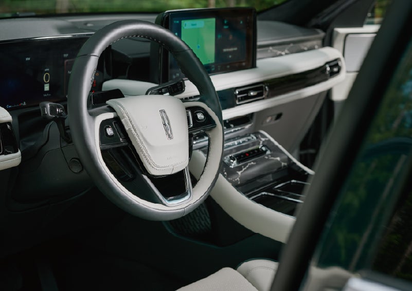The leather-trimmed steering wheel of a 2027 Lincoln Aviator® Black Label™ SUV. | Lincoln of Cutler Bay in Miami FL