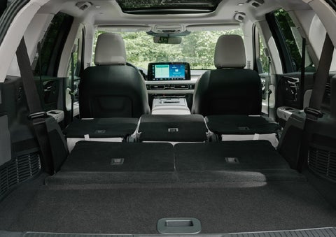 A rear to front view of the interior of a 2027 Lincoln Aviator® Black Label™ SUV shows the third and second rows folded flat | Lincoln of Cutler Bay in Miami FL